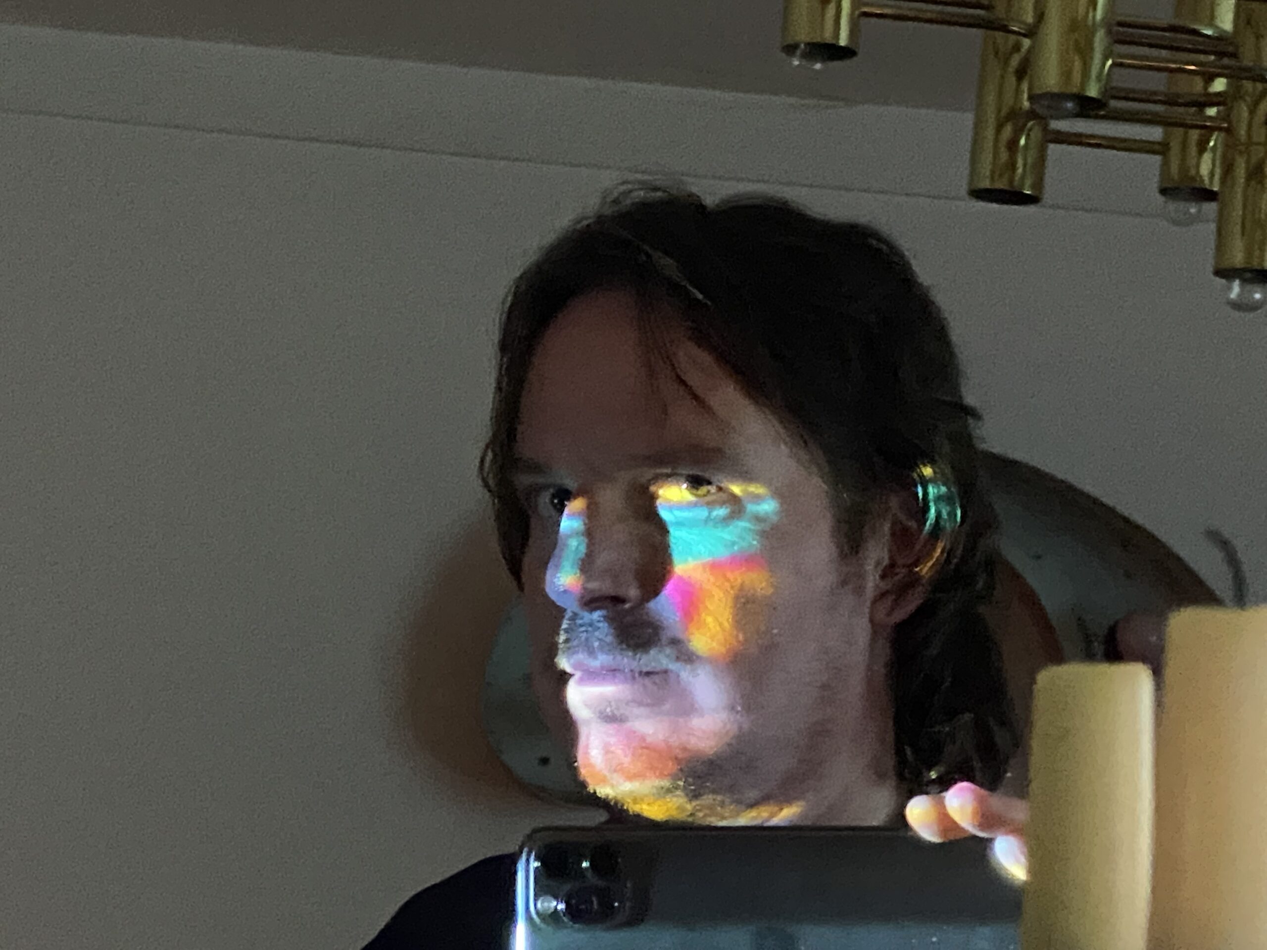 Joe Munro with stupid lights projected onto his face